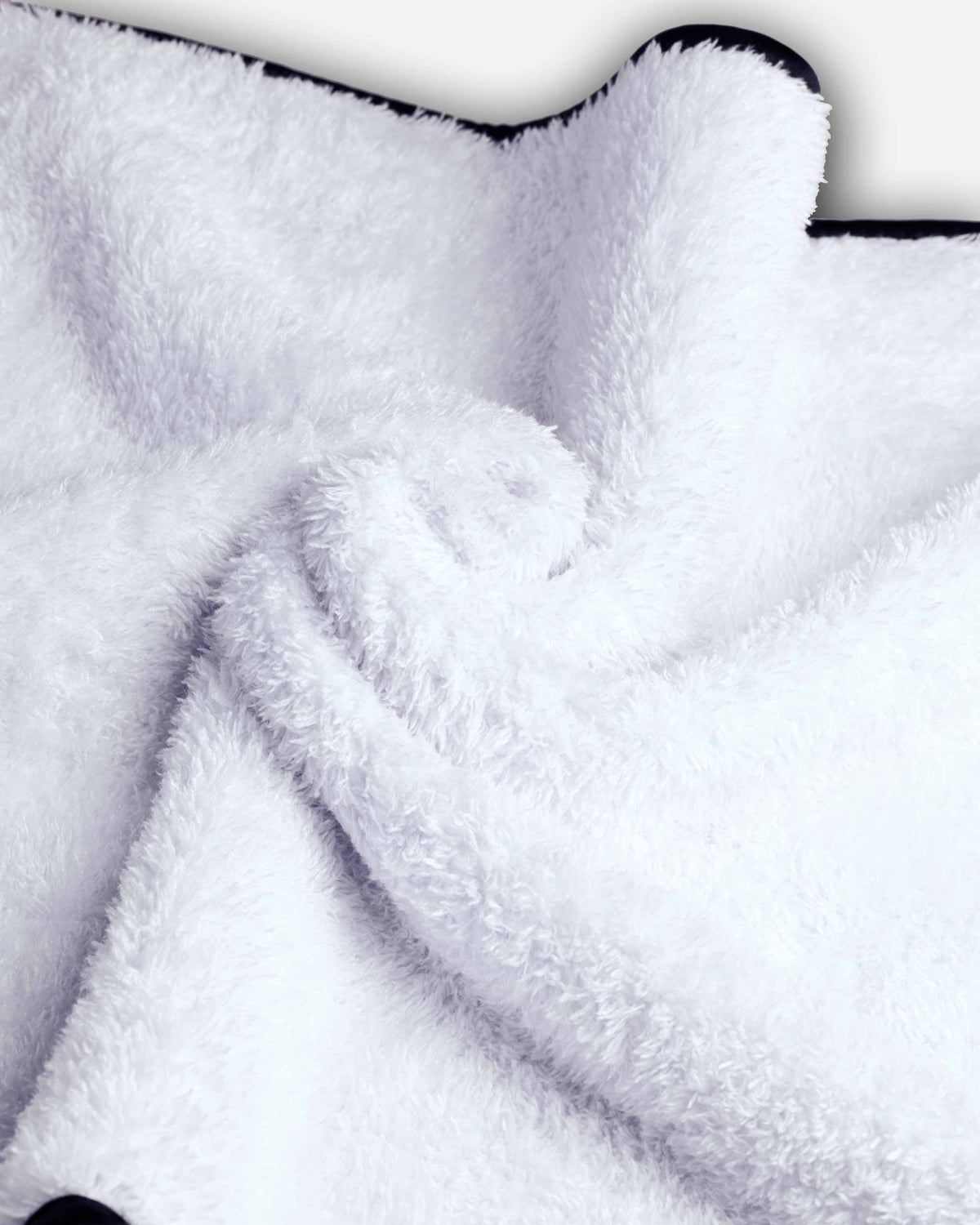 Microfiber Car Cloths twisted to display dense, luxurious pile, ideal for buffing and wiping away residue on vehicle surfaces.