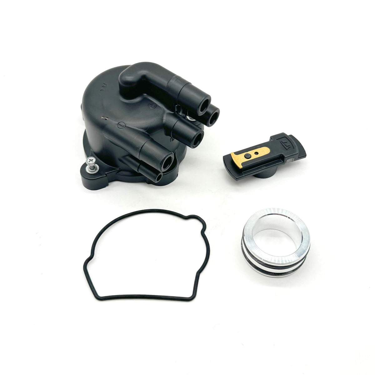 Close-up of Honda Acty distributor replacement kit including distributor cap, rotor, gasket, and collar for HA3, HA4 models (1990-1999).