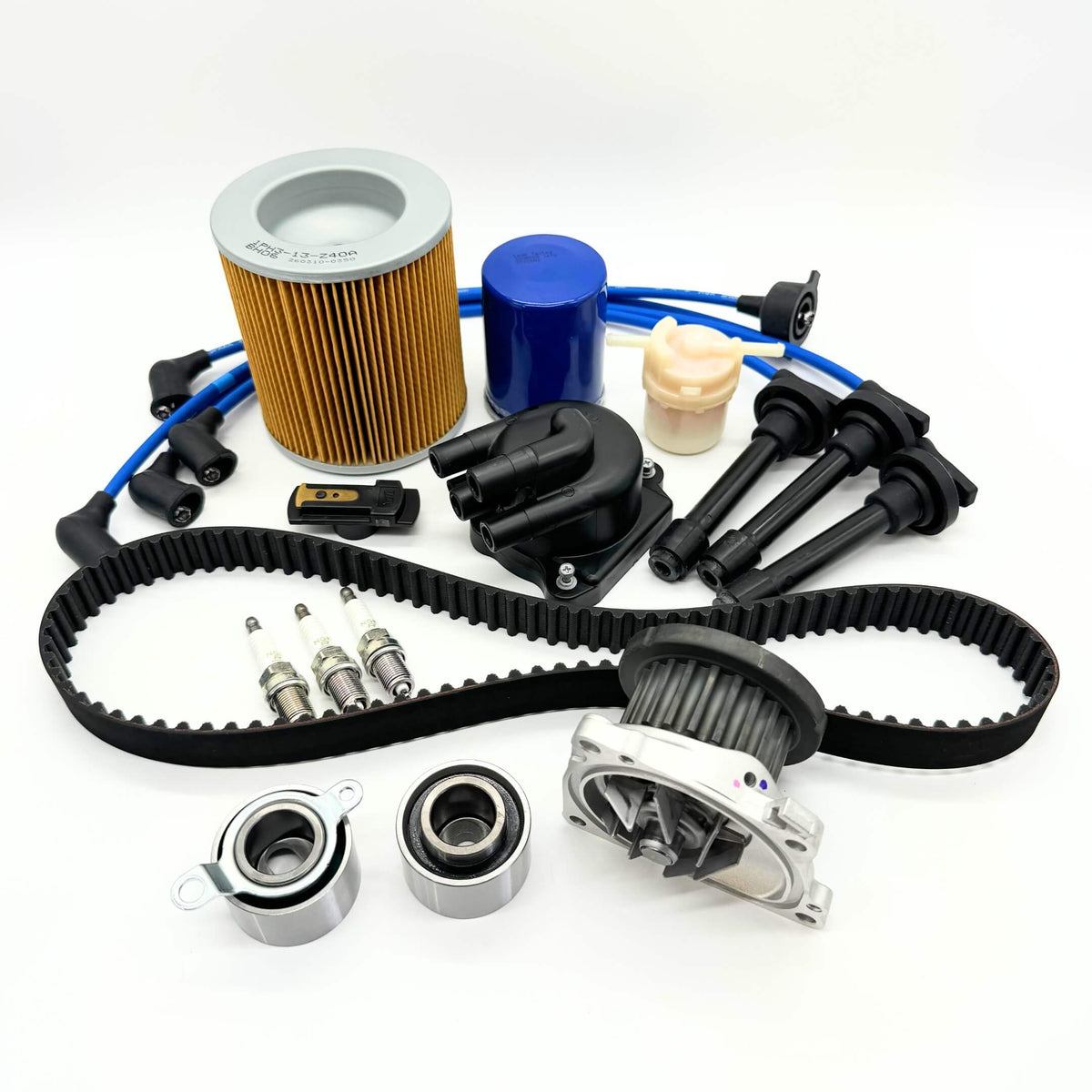 14-piece Mega Timing Belt and Tune-Up Kit for Honda Acty HH3/HH4 1990-1999, featuring an air filter, fuel filter, oil filter, distributor cap and rotor, spark plugs and wires, and a premium timing belt, all displayed on a white background, available with free shipping from Oiwa Garage.