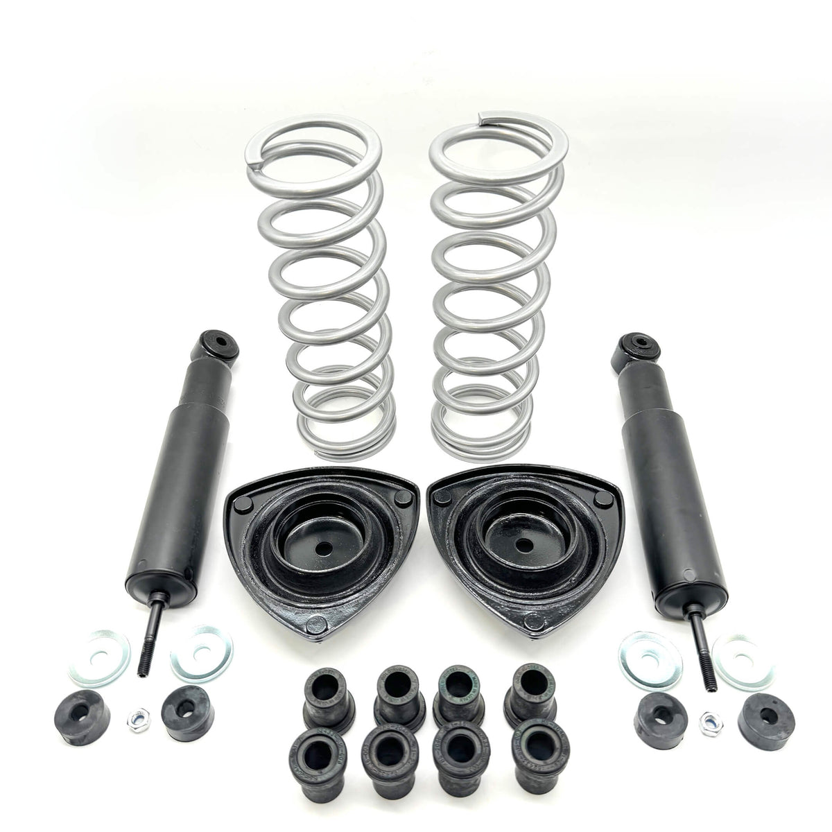 Detailed view of Honda Acty Van suspension kit including silver coil springs, black shock absorbers, and mounting hardware for models 1990-1999.