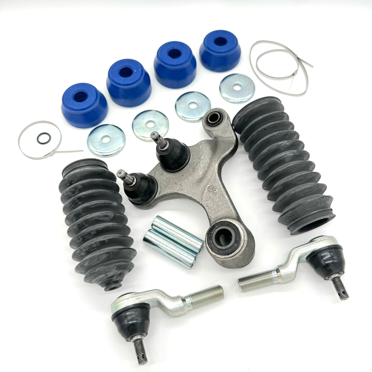 19-piece steering and suspension upgrade kit for Honda Acty HH3, HH4 models (1990-1999) - includes outer tie rods, rubber boots, polyurethane bushings, metal washers, sleeves, clamps, and central steering link for comprehensive vehicle upgrade
