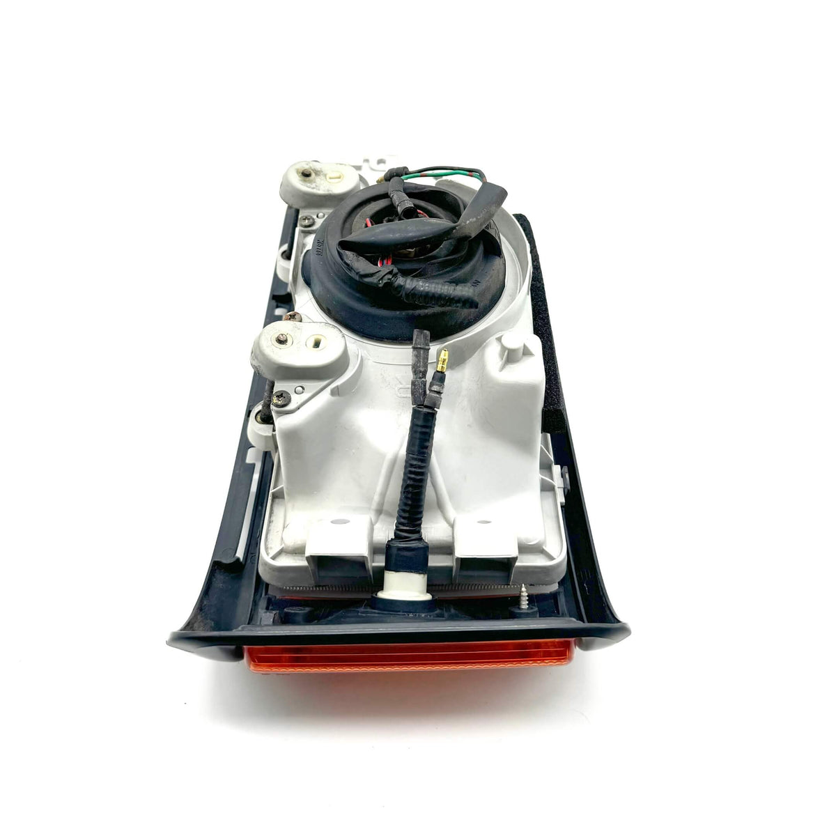 Close-up rear view of right headlight assembly for Honda Acty Van HH3, HH4 models 1990-1993, detailing connectors and housing.