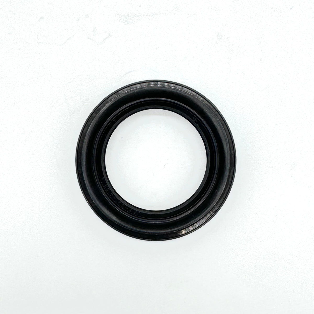 Close-up of the rear right outer wheel seal for 1990-1999 Honda Acty HH3, HH4, crucial for wheel bearing protection.