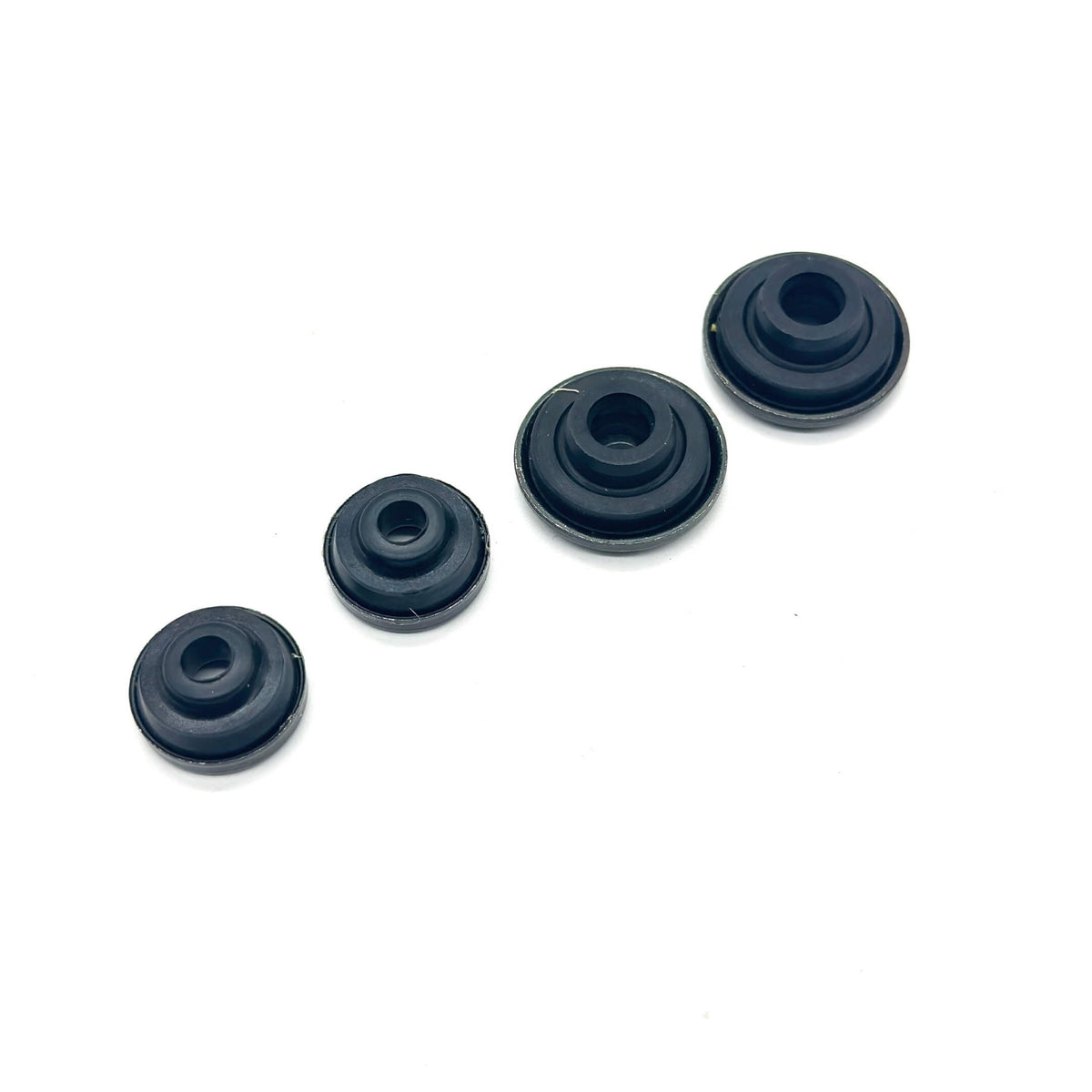 Black Valve Cover Bolt Seal Set featuring four varying sizes for secure engine sealing.