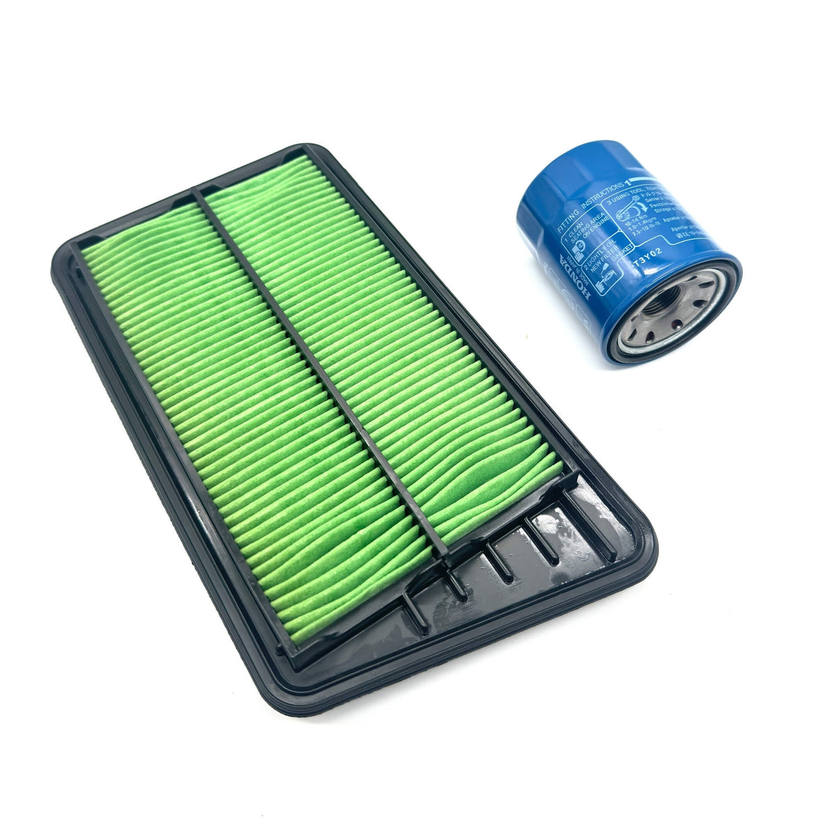 Genuine Honda 2 Piece Filter Package for Honda Acty Truck HA8, HA9 Models (2009-2022) featuring a green air filter and blue oil filter.
