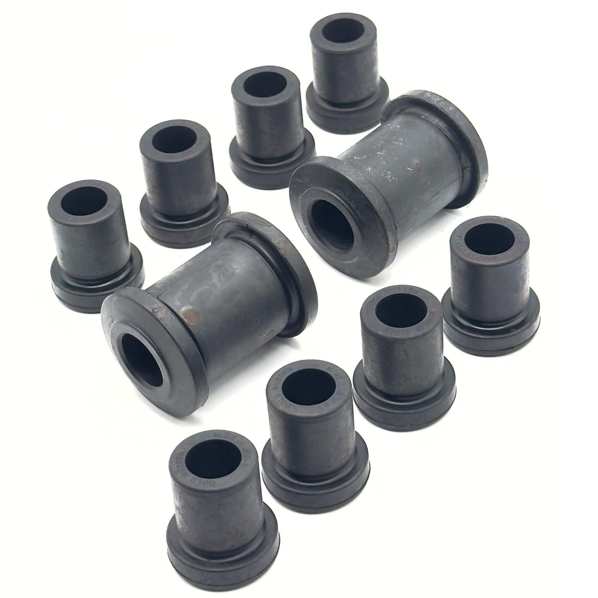 Leaf Spring Bushing Kit for Honda Acty Truck Models HA3, HA4 (1990-1999), featuring durable black rubber bushings for front and rear, left and right installation.