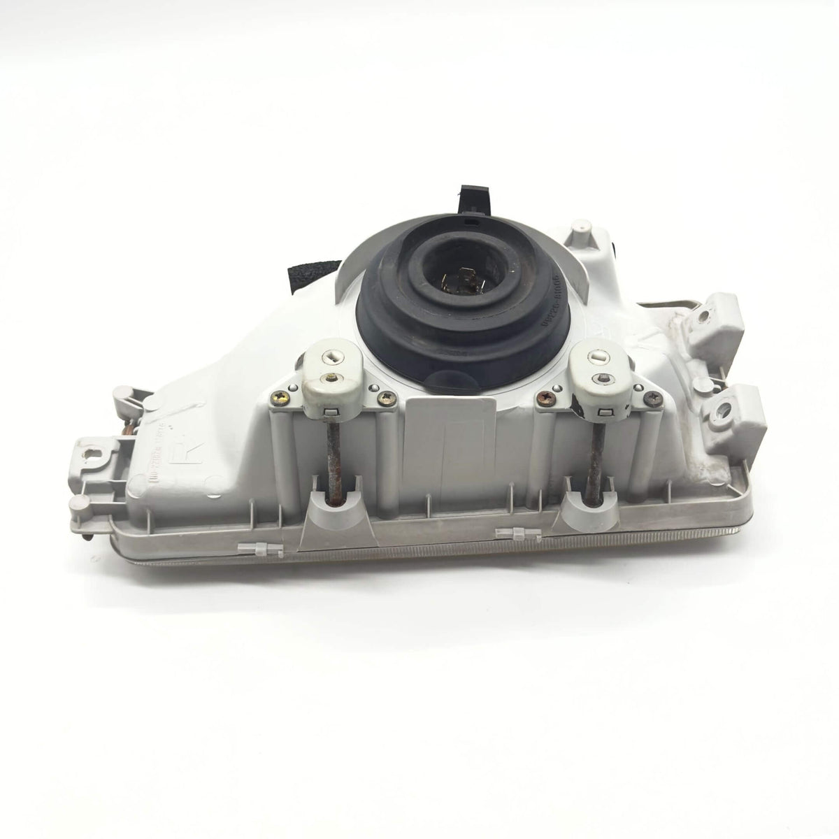 Headlight - Right / Driver Side for Honda Acty Truck Models HA3, HA4 (1990-1993) featuring a durable housing and mounting components.